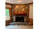 Stone fireplace with a wooden mantle and access to an outdoor deck at 4487 Park Place Ter, Marietta, GA 30066
