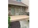 Home's front porch has stone accents, neutral paint, and a cozy outdoor space at 4487 Park Place Ter, Marietta, GA 30066