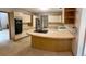 Spacious kitchen featuring ample cabinet space, a breakfast bar, and modern appliances at 4487 Park Place Ter, Marietta, GA 30066