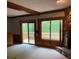 Spacious living room features wood accents and a stone fireplace with deck access at 4487 Park Place Ter, Marietta, GA 30066