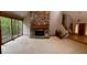 Bright living room with large stone fireplace, big windows, and hardwood floors at 4487 Park Place Ter, Marietta, GA 30066