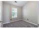 Cozy bedroom with gray carpet, natural light, and ample space for furnishing at 73 Timber Ridge Dr, Cartersville, GA 30121