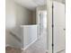 Upstairs hallway featuring neutral carpeting, freshly painted walls, and easy access to bedrooms at 73 Timber Ridge Dr, Cartersville, GA 30121