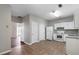 Open kitchen featuring white appliances, white cabinets, and an eat-in area at 73 Timber Ridge Dr, Cartersville, GA 30121