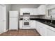 Clean kitchen design with white cabinetry, practical layout, and durable countertops at 73 Timber Ridge Dr, Cartersville, GA 30121