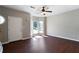 Living room featuring wood floors, a ceiling fan, staircase, and ample natural light at 73 Timber Ridge Dr, Cartersville, GA 30121