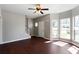 Living room featuring wood floors, a ceiling fan, staircase, and ample natural light at 73 Timber Ridge Dr, Cartersville, GA 30121