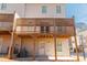 A rear view of a multi-level wooden back porch with lattice at 1110 Bakary Ct, Decatur, GA 30032