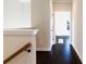 Upstairs hallway with hardwood floors and view to bedroom at 1110 Bakary Ct, Decatur, GA 30032