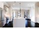 Bright kitchen features a center island, stainless steel appliances, dark hardwood floors, and recessed lighting at 1110 Bakary Ct, Decatur, GA 30032