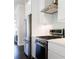 Modern kitchen with stainless steel refrigerator and oven range, white cabinets and light countertop at 1110 Bakary Ct, Decatur, GA 30032