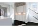 Bright living area featuring custom cabinets and a staircase with black metal and wood railing at 1110 Bakary Ct, Decatur, GA 30032
