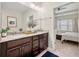 Stylish bathroom featuring double vanity with granite countertop and view of the bedroom at 1647 Sabastian Ne Pt, Atlanta, GA 30329