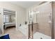 Bright bathroom featuring a walk-in shower, bath tub and access to main bedroom at 1647 Sabastian Ne Pt, Atlanta, GA 30329