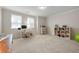 Open bonus room with carpet flooring, desk, and shelving unit at 1647 Sabastian Ne Pt, Atlanta, GA 30329
