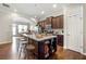 Spacious kitchen featuring a large center island with seating, stainless steel appliances, and hardwood floors at 1647 Sabastian Ne Pt, Atlanta, GA 30329