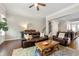 Open-concept living area boasts hardwood floors, stylish furnishings, and a seamless connection to the kitchen at 1647 Sabastian Ne Pt, Atlanta, GA 30329