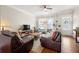 Bright living room with hardwood floors, natural light, and comfortable seating, creating a cozy ambiance at 1647 Sabastian Ne Pt, Atlanta, GA 30329