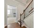 Hallway leading to stairway with wooden banister and railing at 1647 Sabastian Ne Pt, Atlanta, GA 30329