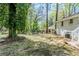 View of the home's backyard showing large trees, grass and exterior of the house at 2240 Polar Rock Sw Ave, Atlanta, GA 30315