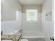 Bright bathroom featuring a shower over tub, white subway tile, and granite vanity at 2240 Polar Rock Sw Ave, Atlanta, GA 30315