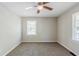Neutral bedroom featuring carpet, ceiling fan, and a bright window at 2240 Polar Rock Sw Ave, Atlanta, GA 30315