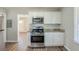Modern kitchen with stainless steel appliances, granite countertops, and hardwood floors for a clean and stylish look at 2240 Polar Rock Sw Ave, Atlanta, GA 30315