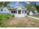 Charming home with a striking white facade and prominent entry stairs, blending modern aesthetics with a classic design at 3353 Hemphill St, Atlanta, GA 30337
