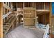 Interior framing of a two-story home under construction, showcasing the staircase and room divisions at 3353 Hemphill St, Atlanta, GA 30337
