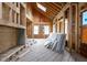 Unfinished living room showcasing exposed wood framing, flooring, and natural light from skylight windows at 3353 Hemphill St, Atlanta, GA 30337