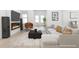 Contemporary living room with sleek furnishings, a modern fireplace, and an abundance of natural light at 3353 Hemphill St, Atlanta, GA 30337
