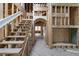 Unfinished living room with visible staircase framework, wood framing, and window placements at 3353 Hemphill St, Atlanta, GA 30337