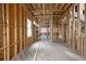 Unfinished living room showing wood framing, window placements, and pre-installation of electrical and plumbing at 3353 Hemphill St, Atlanta, GA 30337