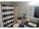 Well-maintained bathroom featuring classic fixtures, a shower, and a modern vanity at 615 Old Johnson Rd, Lawrenceville, GA 30045