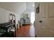 Bright bedroom with hardwood floors, featuring guitars, a vanity, and a blue chair at 615 Old Johnson Rd, Lawrenceville, GA 30045