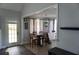 Dining room with a door to the backyard, hardwood floors and a large wooden dining table at 615 Old Johnson Rd, Lawrenceville, GA 30045