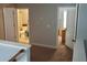 Upper level hallway shows access to a bathroom and bedroom; both with carpet at 615 Old Johnson Rd, Lawrenceville, GA 30045