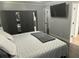 Neutral-toned bedroom boasts a spacious closet and an oversized wall-mounted television at 615 Old Johnson Rd, Lawrenceville, GA 30045