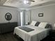 Comfortable bedroom features tray ceiling, neutral color scheme, and generous natural light at 615 Old Johnson Rd, Lawrenceville, GA 30045