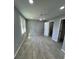 Well-lit bedroom with neutral walls, wood flooring, and a ceiling fan at 912 Holden Ln, Atlanta, GA 30349