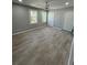 Spacious bedroom featuring neutral paint, ceiling fan, two windows, and ample closet space at 912 Holden Ln, Atlanta, GA 30349