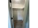 Walk-in closet with rod for hanging clothes and wood-look flooring at 912 Holden Ln, Atlanta, GA 30349