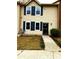 Inviting two-story home with blue shutters and a well-maintained lawn at 912 Holden Ln, Atlanta, GA 30349