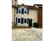 Charming two-story home with blue shutters and inviting front walkway at 912 Holden Ln, Atlanta, GA 30349