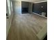 Bright living room with fireplace and light, wood-look flooring at 912 Holden Ln, Atlanta, GA 30349