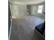 Spacious living room featuring modern flooring and neutral paint at 912 Holden Ln, Atlanta, GA 30349