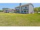 Exterior view of the house and backyard with a well-maintained lawn at 125 Leverett Ct, Fayetteville, GA 30215