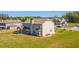 A well-maintained backyard with green lawn and a view of neighboring homes at 125 Leverett Ct, Fayetteville, GA 30215