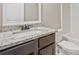 Bathroom featuring granite countertops, dark cabinets, a toilet, and a shower/tub combo at 125 Leverett Ct, Fayetteville, GA 30215