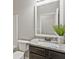 Bathroom featuring granite countertop, framed mirror, stylish vanity, and neutral color scheme at 125 Leverett Ct, Fayetteville, GA 30215